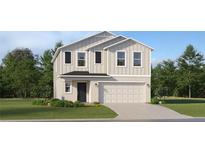 Charming two-story home with a two-car garage and well-manicured front lawn at 999 Hour Glass Rd, Lakeland, FL 33801