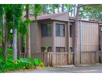 The exterior of this home has natural looking trim, a front entrance, and tropical-looking shrubbery at 5310 Pebble Beach Dr # F, Orlando, FL 32811