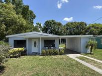 Charming single-story home featuring a well-maintained lawn and a convenient covered carport at 705 Grandview Ave, Altamonte Springs, FL 32701
