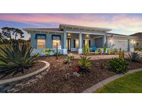 Charming single-story home with colorful desert landscaping and inviting covered porch at 10298 Sw 96Th Loop, Ocala, FL 34481