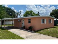 Charming single-story home with a carport and a well-maintained front yard at 1923 Beechwood Dr, Lakeland, FL 33803