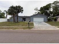 Charming single-story home featuring a two-car garage and mature landscaping at 606 Lakespur Ln, Altamonte Springs, FL 32714
