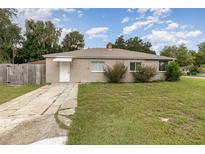 Charming single-story home featuring a well-maintained lawn and a classic facade with a clean, white door at 130 E Pendleton Ave, Eustis, FL 32726