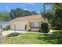Charming single-story home with a well-maintained lawn, neutral paint and tile roof at 454 San Jose Dr, Winter Haven, FL 33884