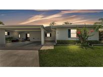 Charming single-story home with a well-manicured lawn and covered parking at 3582 Milano Ave, Lakeland, FL 33803