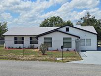 Charming single-story home featuring fresh exterior paint, new roof and meticulously maintained landscaping at 17 Oak Loop, Ocala, FL 34472
