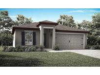 Charming single-story home with a two-car garage, landscaped yard, and inviting front entrance at 1625 Nantucket Way, Winter Haven, FL 33884