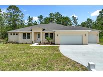 Charming single-story home with well-manicured lawn and attached two car garage at 19041 Mardi Gras St, Orlando, FL 32833
