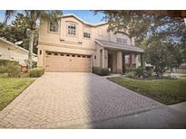 Charming two-story home with a two-car garage and well-maintained landscaping at 310 Stakes Ct, Deland, FL 32724