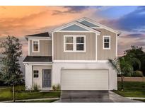Charming two-story home with a front-entry two car garage and well-manicured landscaping at 4019 Gardenia Ave, Lake Hamilton, FL 33851