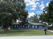 Charming single-story home with a well-maintained lawn and mature trees providing ample shade at 3453 Duff Rd, Lakeland, FL 33810
