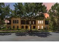 Beautiful two-story townhome with balconies, lush landscaping, and ample parking at 504 Mirasol Cir # 102, Kissimmee, FL 34747