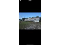 Well-maintained single-story home with a wheelchair ramp leading to the front porch at 12385 Se 86Th Ave, Belleview, FL 34420