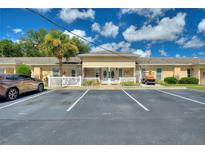 Charming condo with beautiful landscaping, designated parking, and a manicured lawn at 4709 Club Cir, Lakeshore, FL 33854