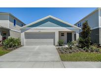 Charming single-Gathering home with a well-manicured front yard and a two-car garage at 4011 Gardenia Ave, Lake Hamilton, FL 33851