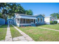 Charming single Gathering home with a well-manicured lawn and vibrant landscaping, enhancing its curb appeal at 549 Palencia Pl, Lakeland, FL 33803