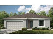 Charming single-story home with a well-maintained lawn and a two-car garage at 2047 Babbling Brook Blvd, Auburndale, FL 33823