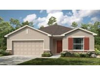 Charming single-story home with a two-car garage and well-maintained lawn at 2072 Babbling Brook Blvd, Auburndale, FL 33823