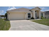 Charming single-story home with a well-maintained lawn and a two-car garage at 3629 Welsh Way, Lakeland, FL 33813