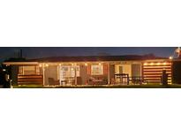 A well lit backyard provides additional space for gathering and entertaining at 4119 Chambers St, Lake Wales, FL 33898