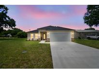 Charming single-Gathering home featuring a well-manicured lawn and a two-car garage in a peaceful neighborhood at 4189 Homestead Dr, Lakeland, FL 33810