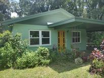 Charming ranch home with a newly painted exterior and landscaped yard at 422 22Nd Sw St, Winter Haven, FL 33880