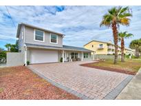 Charming single-Gathering home with a brick driveway and mature landscaping at 4766 S Atlantic Ave, Ponce Inlet, FL 32127