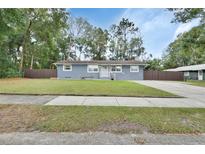 Charming single-story home with a well-maintained lawn and neutral exterior paint at 714 E Michigan Ave, Deland, FL 32724