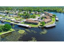 Waterfront condo complex features boat slips and a beautiful view of the surrounding landscape at 1640 Juno Trl # 205A, Astor, FL 32102