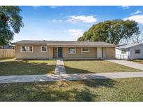 Ranch style home with a newly landscaped lawn and updated exterior at 2318 Fairgren Ave, Deltona, FL 32738