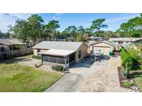 Single-story home with screened porch and boat parking at 1391 San Carlos Ave, Deltona, FL 32738