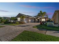 Attractive single-story home with a paved driveway and lush landscaping at 2815 Sienna View Ter, New Smyrna Beach, FL 32168