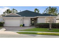 Beautiful one-story home with a two-car garage and landscaped lawn at 3558 Nw 56Th Ave, Ocala, FL 34482