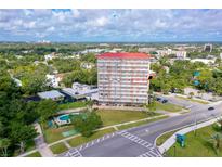 Aerial view of a condo building with surrounding landscape at 404 S Beach St # 240 701, Daytona Beach, FL 32114