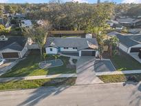 Aerial view of a renovated single story home with a landscaped yard at 612 Moonpenny Cir, Port Orange, FL 32127