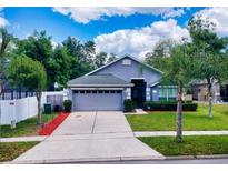 Lovely house with a two-car garage and well-manicured lawn at 2911 Wild Pepper Ave, Deltona, FL 32725