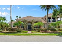 Two-story house with palm trees and well-maintained landscaping at 3548 Tuscany Reserve Blvd, New Smyrna Beach, FL 32168