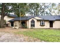 Ranch style home with a large front yard and fountain at 8101 Via Bonita St, Sanford, FL 32771