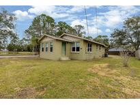 Brick house with a green door and large yard at 639 Florida Ave, Daytona Beach, FL 32117