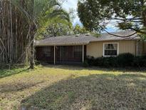 Ranch-style home with brick accents and a spacious yard at 218 W Magnolia Ave, Longwood, FL 32750