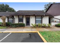 Condo exterior featuring a well-maintained facade and landscaping at 245 Terrace Hill Blvd # 1E, Debary, FL 32713