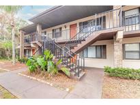 Two-story building exterior with stairs and landscaping at 1668 Spring Garden Ct # 1668, Daytona Beach, FL 32117