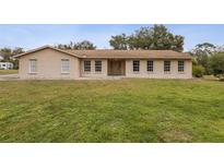 Single-story house with a large yard at 1870 S Lehigh Dr, Deltona, FL 32738