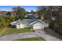 Single-story house with a fenced yard and driveway at 461 Providence Blvd, Deltona, FL 32725