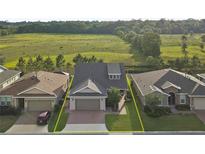 Aerial view of a house and surrounding landscape at 5589 Nw 40Th Loop, Ocala, FL 34482