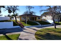 Ranch-style home with a large front yard and mature trees at 2728 S Peninsula, Daytona Beach, FL 32118