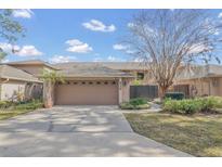 Charming single-story home with a two-car garage and well-maintained landscaping at 510 Sandy Bluff Trl, Deland, FL 32724