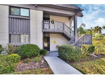 Condo exterior featuring a well-maintained facade, lush landscaping, and inviting entrance at 600 N Boundary Ave # 114B, Deland, FL 32720