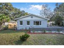 Charming home featuring fresh exterior paint, manicured lawn, and decorative front accents at 829 Madison Ave, Daytona Beach, FL 32114