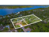 Aerial view of wooded homesite with river views in a desirable neighborhood at 2918 Hardy Ave, New Smyrna Beach, FL 32168